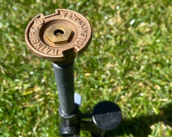 Commercial quality sprinkler spike with new 1970’s Rain Bird spray head beautiful portable coverage.