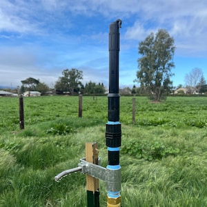 New T-Post sprinkler clamp with the most incredibly efficient sprinkler 40&#39; of perfect raindrops falls and smells like rain!