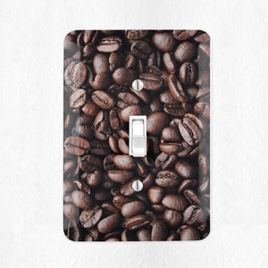 May include: A light switch cover with a close-up image of brown coffee beans.
