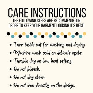 May include: Care instructions for a garment. The instructions include turning the garment inside out for washing and drying, machine washing cold on delicate cycle, tumble drying on low heat, not bleaching, not dry cleaning, and not ironing directly on the design.