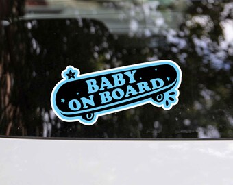 May include: A blue and black sticker with a skateboard design that says "Baby on Board".