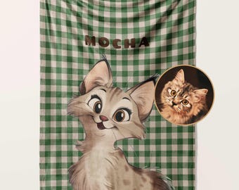 May include: A green and white checked fleece blanket with a cartoon cat illustration and the name "MOCHA" printed in brown letters.