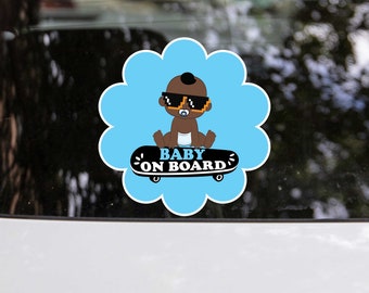 May include: Blue and black baby on board car sticker with a cartoon baby wearing sunglasses and riding a skateboard. The text "Baby on Board" is written on the skateboard.