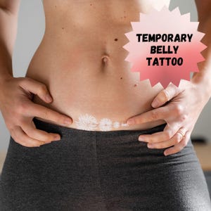 May include: A person's belly with a temporary belly tattoo of white fireworks. The text "TEMPORARY BELLY TATTOO" is in a pink and white starburst shape.