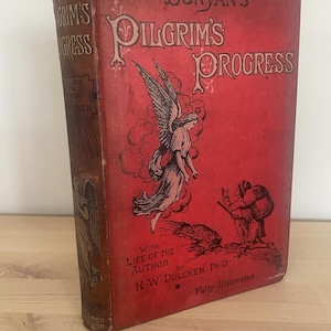 May include: A vintage copy of "Bunyan's Pilgrim's Progress" with a red cover and illustrations. The cover features an angel and a figure with a backpack. The book's spine is brown with gold lettering. The book is fully illustrated.