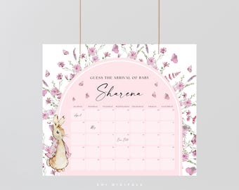 May include: A baby shower calendar with a pink and white design. The calendar features a watercolor illustration of a bunny and floral accents. The text "Guess the Arrival of Baby Sharena" is displayed at the top. The calendar is decorated with butterflies.