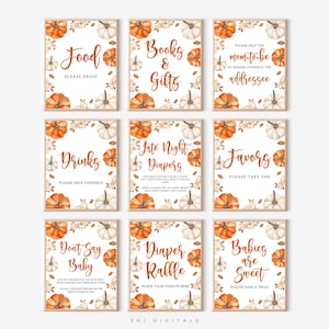 May include: A set of nine rectangular signs with white backgrounds, featuring watercolour orange pumpkins and autumn leaves. Each sign displays brown cursive text including Food, Books & Gifts, Mom-to-be, Drinks, Late Night Diapers, Favors, Don't Say Baby, Diaper Raffle, and Babies are Sweet.