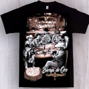 May include: Black t-shirt with a graphic print of a group of men playing cards in a dimly lit room. The text "Baraja de Oro" is printed in gold on the bottom of the shirt.