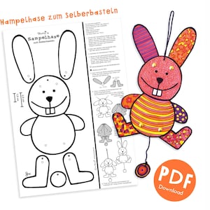 May include: A colorful, handmade bunny craft with the text "Hampelhase zum Selberbasteln". The craft features a red body with orange and yellow stripes, and purple and orange patterned accents. A PDF download button is visible.