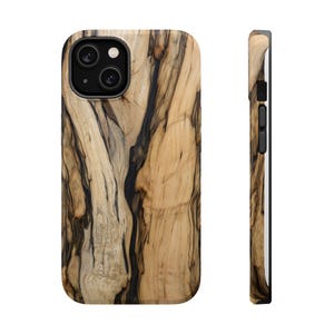 May include: A wooden phone case with a natural wood grain pattern in shades of tan and black. The case has a rounded rectangular shape with a camera cutout and black buttons on the side. The phone case is shown from the front and side.