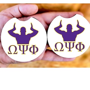 May include: Two white round drink coasters featuring a purple silhouette of a person with arms raised above their head. The text "ΩΨΦ" is written in yellow below the silhouette.