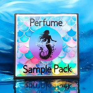 Puede incluir: Una caja negra con un diseño de sirena y el texto "Perfume Sample Pack" sobre un fondo azul.