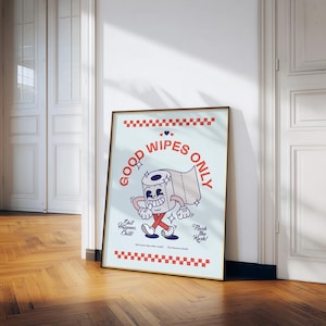 May include: A framed poster with a cartoon toilet paper roll character that reads "Good Wipes Only." The poster has a light blue background with red accents and the phrases "Shit Happens, Chill!" and "Flush the Rush!"