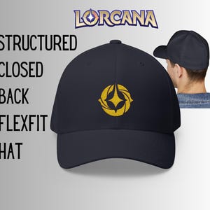 May include: Navy blue Flexfit hat with a structured, closed back. The hat features a gold embroidered emblem and the word "Lorcana" above. The text "Structured Closed Back Flexfit Hat" is also visible.