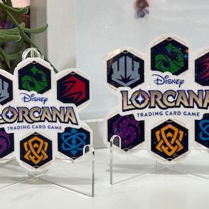 Lorcana-sticker | Sticker | Met het Lorcana-logo omgeven door de zes inktkleuren | Waterdichte sticker | Vinylsticker: