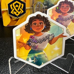 Adesivo Encantado da Família Lorcana Mirabel Madrigal | Céus Cintilantes | Encanto | Âmbar | Presente Divertido | Adesivo de Vinil à Prova D'água | Deck