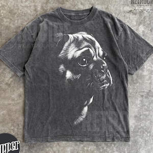 May include: A charcoal grey short-sleeve t-shirt featuring a white graphic illustration of a dog's face in profile. The fabric has a washed, faded appearance. The text "RETROCIDE" is printed in the top right corner and "Pepper" in a circle.