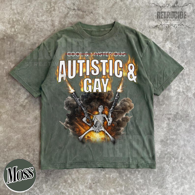 May include: Moss green t-shirt with the text "COOL & MYSTERIOUS AUTISTIC & GAY" in white and orange. The graphic features a skeleton holding two guns with flames and smoke.