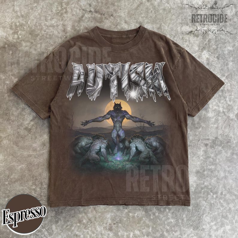 May include: A brown short-sleeve t-shirt featuring the word AUTISM in a metallic, jagged font at the top. Below the text is a graphic of a central werewolf figure standing with arms outstretched before a full moon, surrounded by four other wolves.
