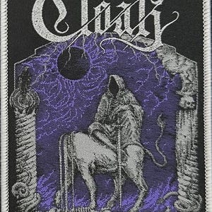 May include: Black and white embroidered patch with the word "Cloak" in a gothic font. The patch features a skeletal figure riding a horse through a purple, textured archway.