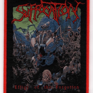 May include: Embroidered patch with the word "SUFFOCATION" in red, stylized lettering above a detailed blue and green graphic. The patch has a black border with a red stitched edge and the text "Effigy of the Forgotten" in red.
