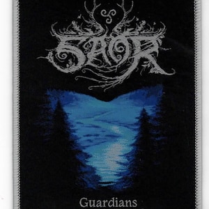 May include: Black and white embroidered patch with the band name "SAOR" in a stylized font. The patch features a blue and white landscape with trees and the text "Guardians" at the bottom.