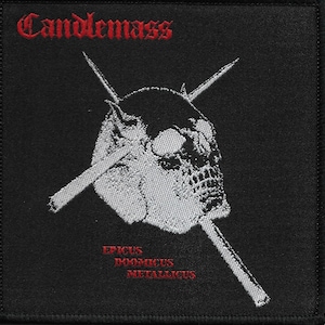 May include: Black and white embroidered patch with a skull and crossed swords. The text "Candlemass" is in red at the top and "Epicus Doomicus Metallicus" is in red at the bottom.