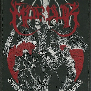 May include: A rectangular black fabric patch featuring a red and white embroidered graphic. The design displays the text Marduk in red, with the words Those of the Unlight in white below. A central winged figure sits above a group of figures.