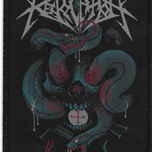 May include: Black and white embroidered patch with a skull and snake design. The text "REVOLVER" is embroidered in silver thread above the skull.