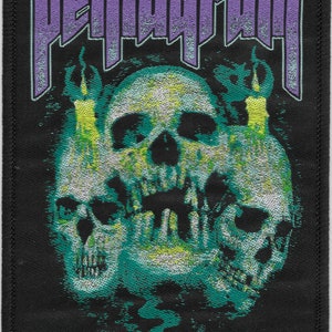 May include: Black patch with a purple "Pentagram" logo and a green and white skull with flames on either side.