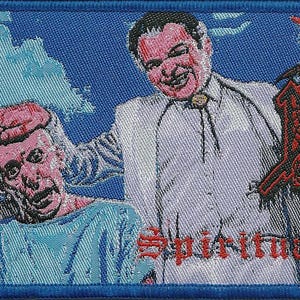 May include: A rectangular embroidered patch featuring a blue background with a graphic illustration of several people and a central figure in a white suit. The text DEATH is in red with a black outline, and the text SPIRITUAL HEALING is in red.