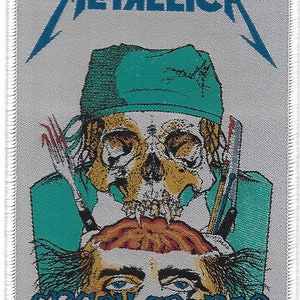 May include: Embroidered patch featuring the band name "METALLICA" above a skull wearing a teal surgical cap. The skull has surgical tools and a brain graphic. The text "CRASH COURSE IN BRAIN SURGERY" is below the brain.