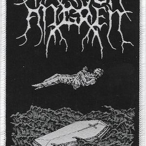 May include: Black and white embroidered patch with the text "Darkthrone" and a graphic of a body floating above a coffin in a dark, watery abyss.