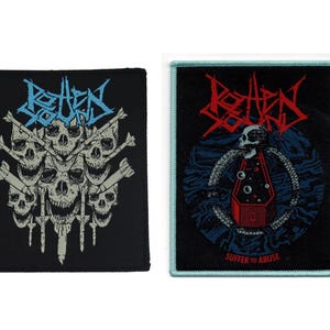 May include: Two black embroidered patches with white stitching. The left patch features a skull and crossbones design with the text "Rotten Sound". The right patch features a coffin with a skull inside and the text "Rotten Sound Suffer to Abuse".