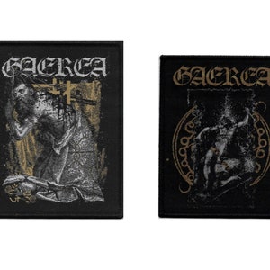 May include: Two black fabric patches with the band name "GAEREA" printed in gold lettering. The left patch features a black and white image of a person with their head in their hands. The right patch features a black and white image of a person with their head in their hands surrounded by a gold circle.