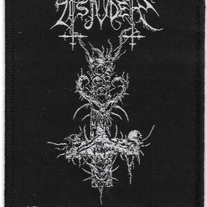 May include: Black and white embroidered patch with the band name "Tsjuder" and the text "Desert Northern Hell".