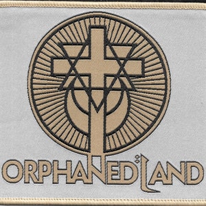 May include: A beige and black embroidered patch with the text "ORPHANED LAND" and a circular design featuring a cross, a star, and a crescent moon.