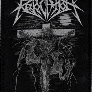May include: Black and white woven patch with the band name "REVELATION" in a stylized font. The patch features a cross with a figure on it, surrounded by lightning bolts and a moon.