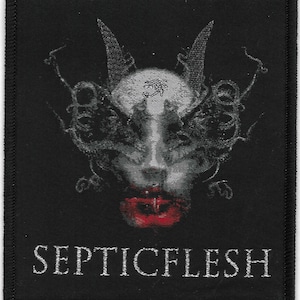 May include: Black and white embroidered patch with a stylized image of a face with horns and a red mouth. The text "SEPTICFLESH" is below the image.