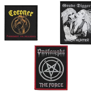 May include: Three black and white embroidered patches with band names and logos. The top patch reads "Grave Digger Witch Hunter" with a black and white image of a man and woman. The middle patch reads "Coroner Punishment for Decadence" with a black and white image of a figure in a hooded robe. The bottom patch reads "Onslaught The Force" with a black and white image of a pentagram.