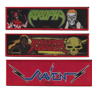 May include: Three embroidered patches with red borders. The top patch features a green and black logo with the text "ATROPHY" and a jester with a red and white checkered costume. The middle patch features a skull with horns and the text "NUCLEAR ASSAULT". The bottom patch features a silver and blue logo with the text "RAVEN".