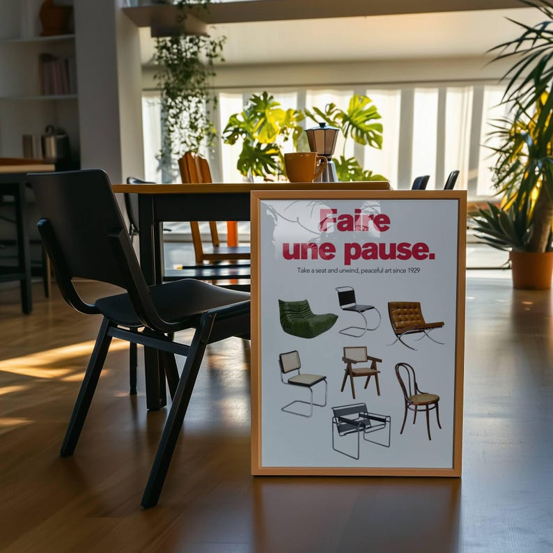 May include: A framed poster with the text "Faire une pause." in red and black lettering. The poster features a variety of chairs and the text "Take a seat and unwind, peaceful art since 1929."