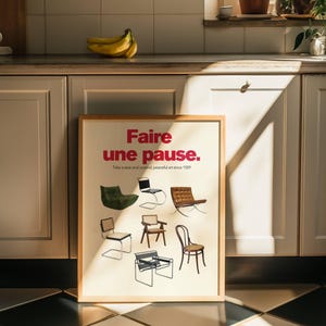 May include: A framed poster with the text "Faire une pause." in red and black lettering. The poster features a variety of chairs in different styles and colors. The text "Take a seat and unwind, peaceful art since 1929" is printed below the main text.