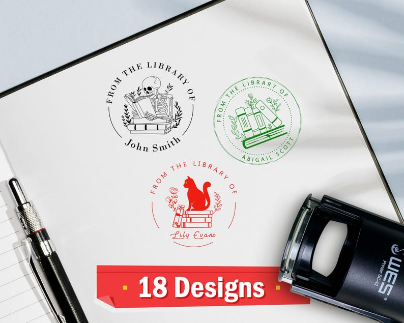 May include: Three custom library stamps with unique designs. One features a skeleton reading, another has stacked books, and the third showcases a cat on books. The stamps are in black, green, and red ink, with names below. The image also shows the text "18 Designs".