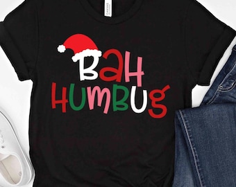 May include: Black t-shirt with a red Santa hat and the words "Bah Humbug" in colorful letters.