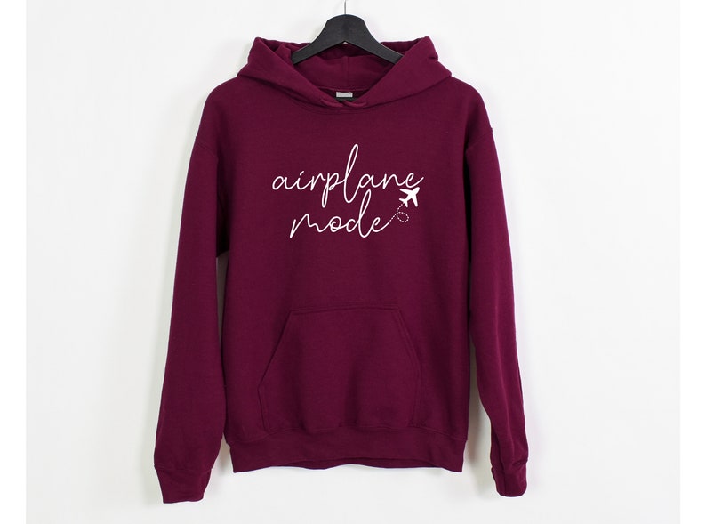 a maroon sweatshirt with the words applique made written on it