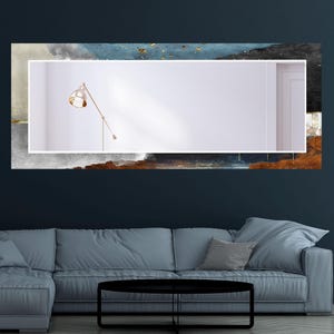 a living room with a couch and a painting on the wall
