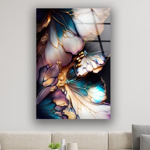 May include: Abstract art print featuring a colourful floral design with gold accents. The artwork is a mix of blue, purple, white, and gold colours.