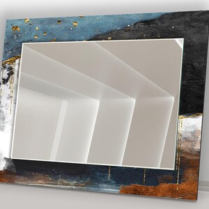 a mirror that is sitting on a wall