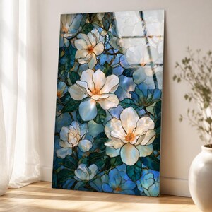Stained-glass-style floral wall art with cream petals, dark outlines, and teal leaves.